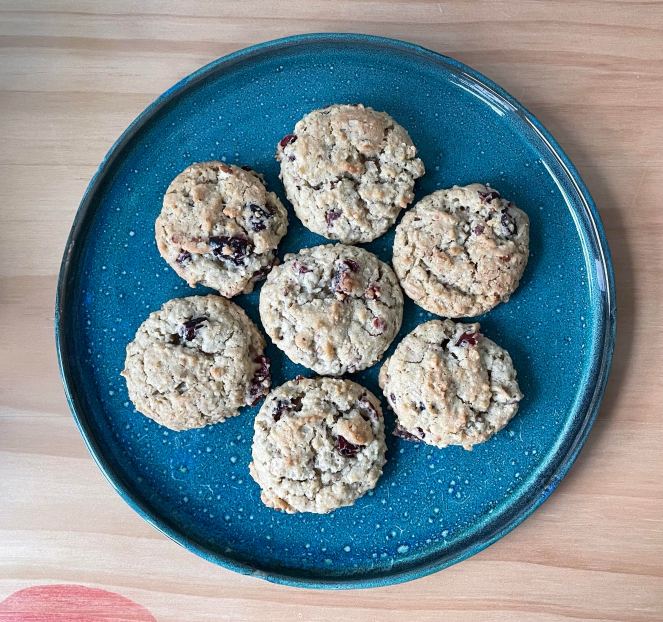 seven oatmeal cookies on a blue speckled plate