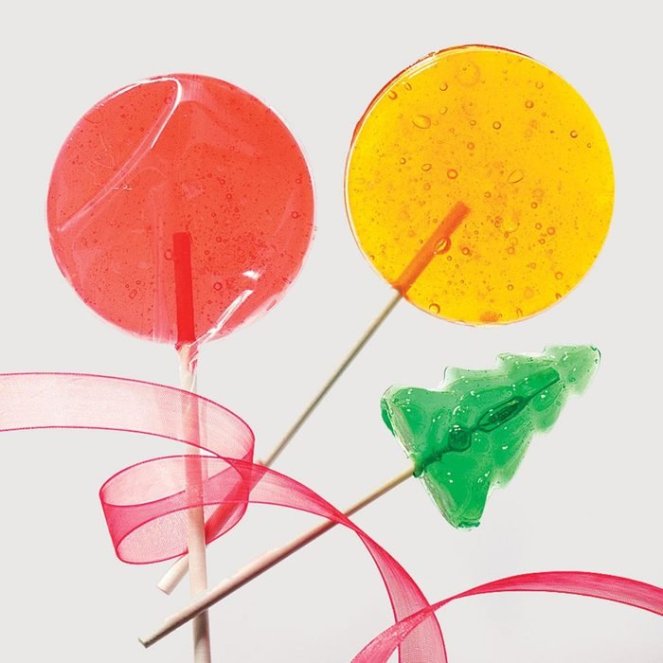 red, yellow and green pine shape lollipops with red ribbon