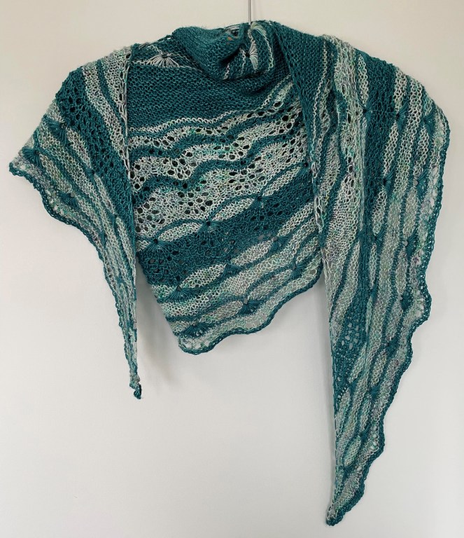 handknit shawl in teal and varigated yarn