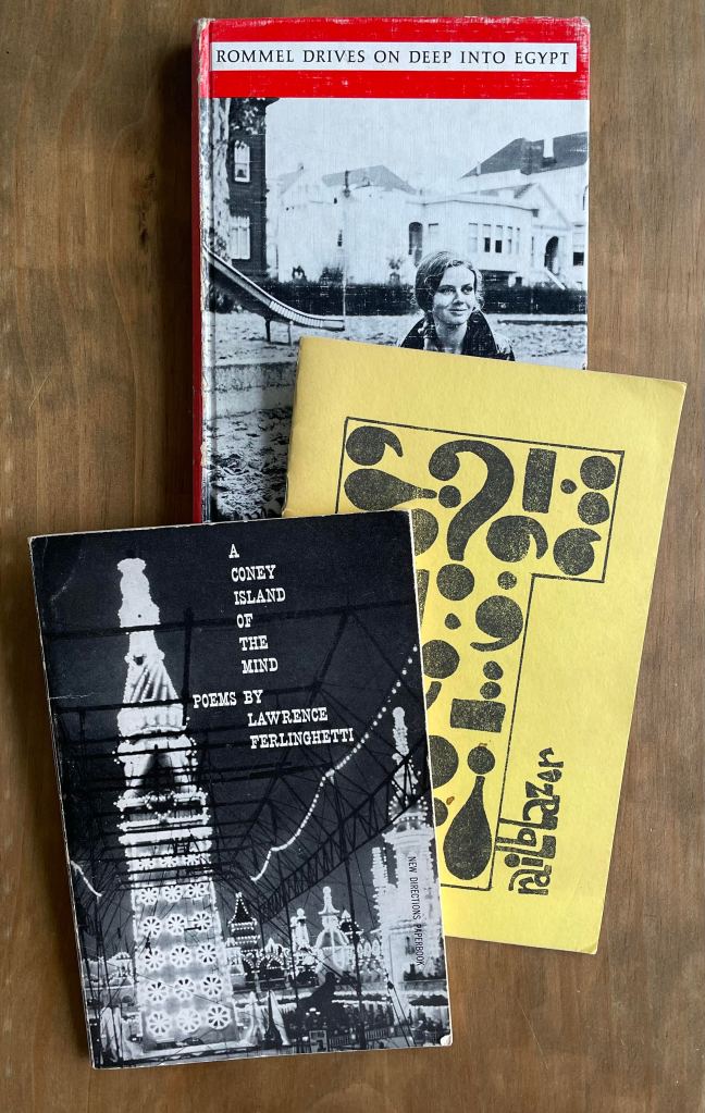 three books against wood background