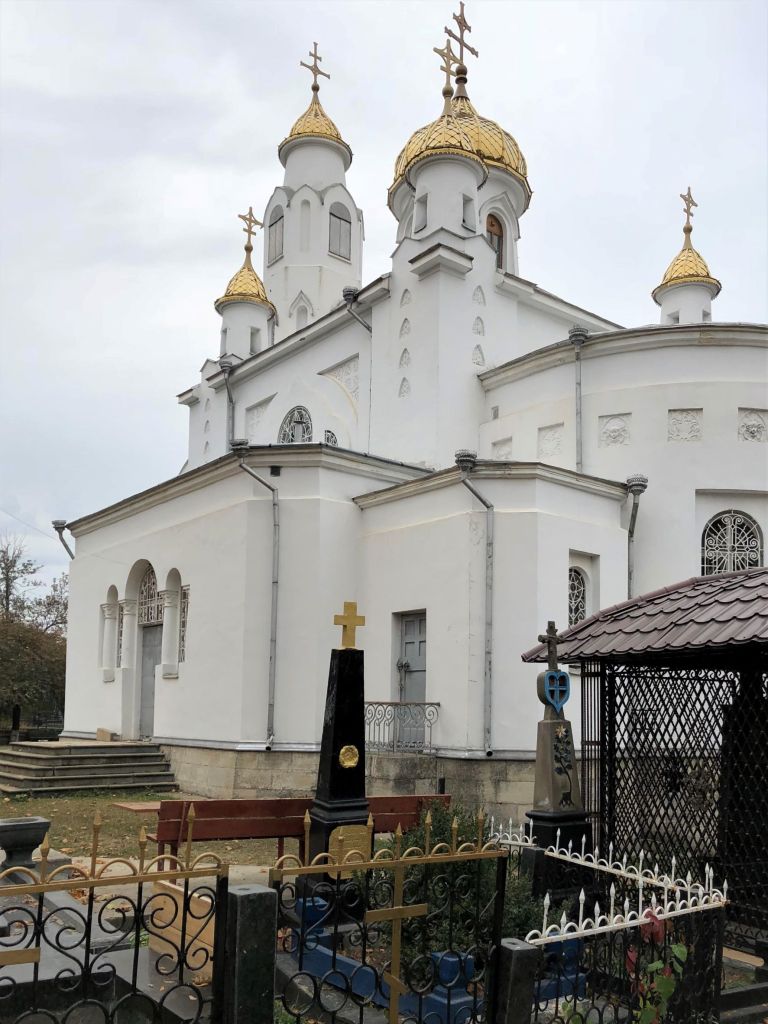 white church with gold domes