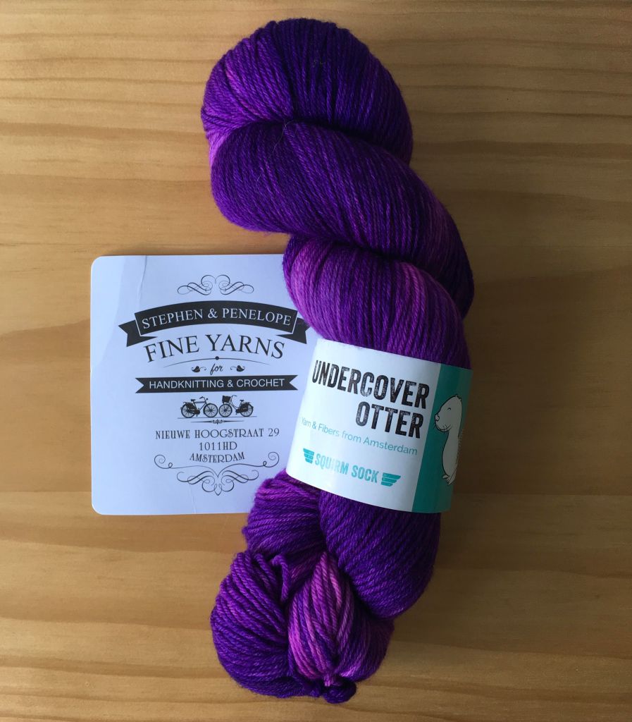 1 skein of purple yarn with white label