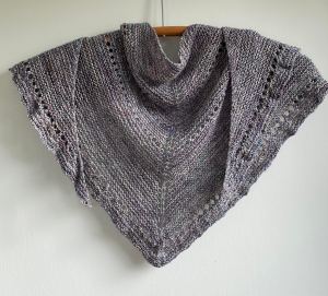 handknit blue kerchief on wooden hanger