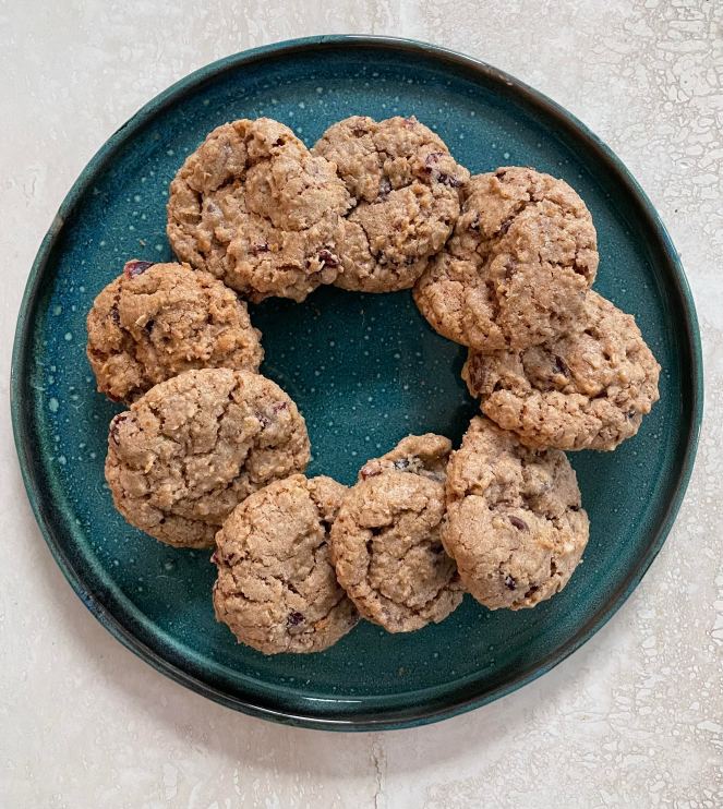 nine oatmeal cookies on a blue-green plate
