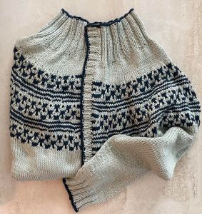 handknit cardigan in light sage with navy blue accents
