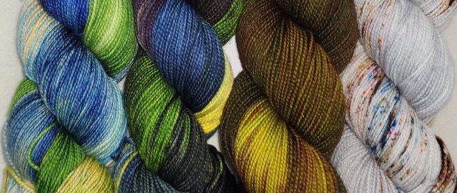 four skeins of multi-colored varigated yarn