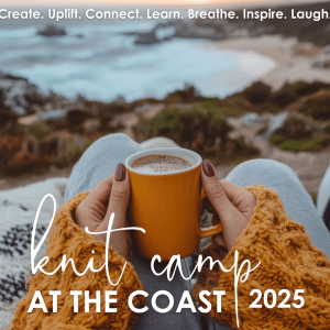 the foreground shows a woman's wrists in gold sweater sleeves, two hands hold a large cup of coffee; the background shows the seashore