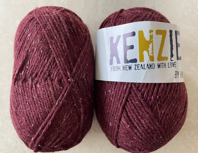 two skeins of beetroot colored yarn