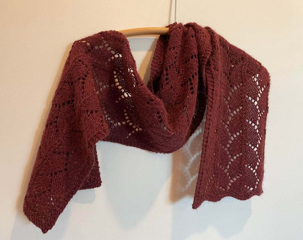 lacy handknit scarf in burgundy yarn